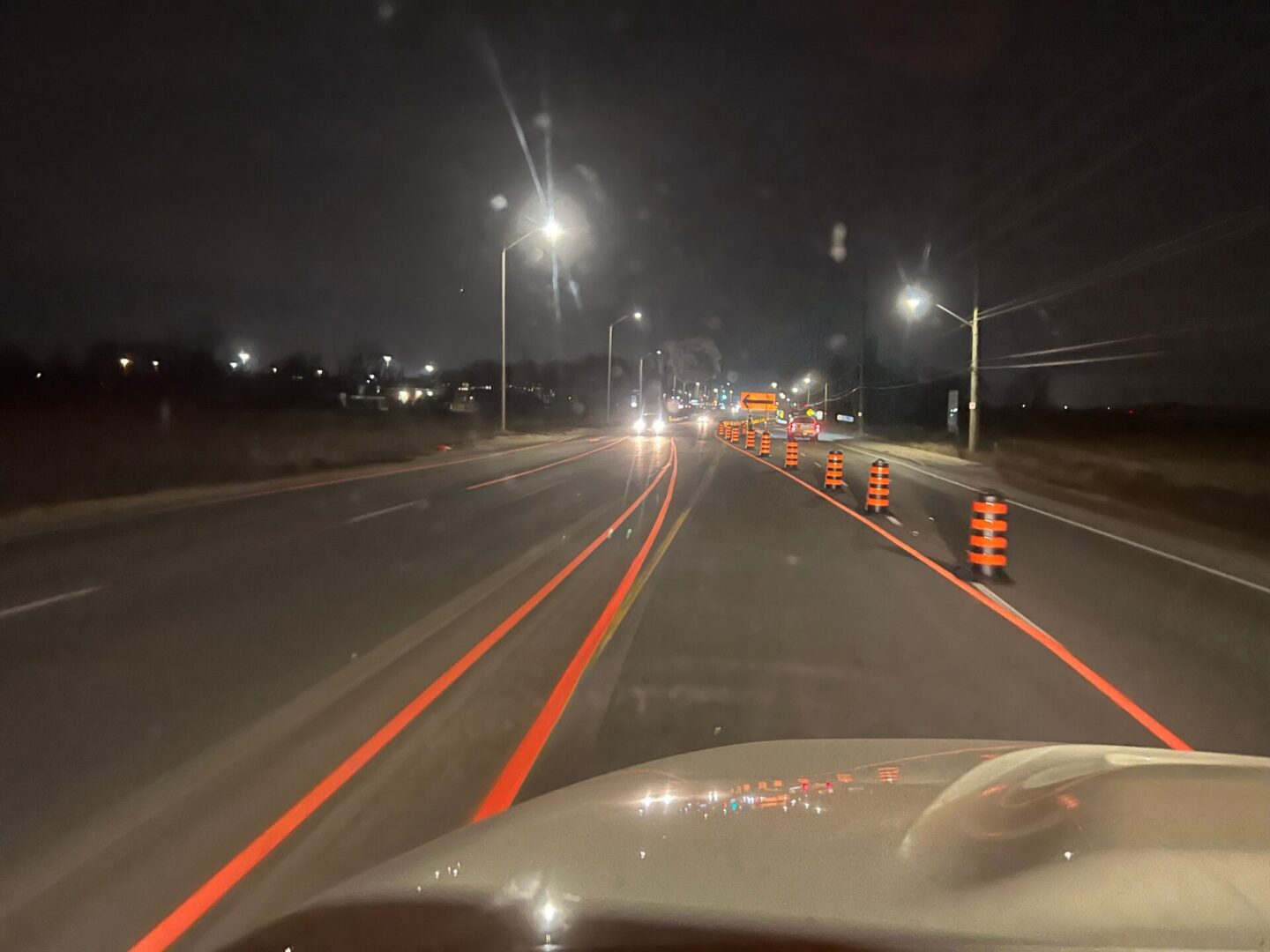 The orange color durable markings on the road with cones