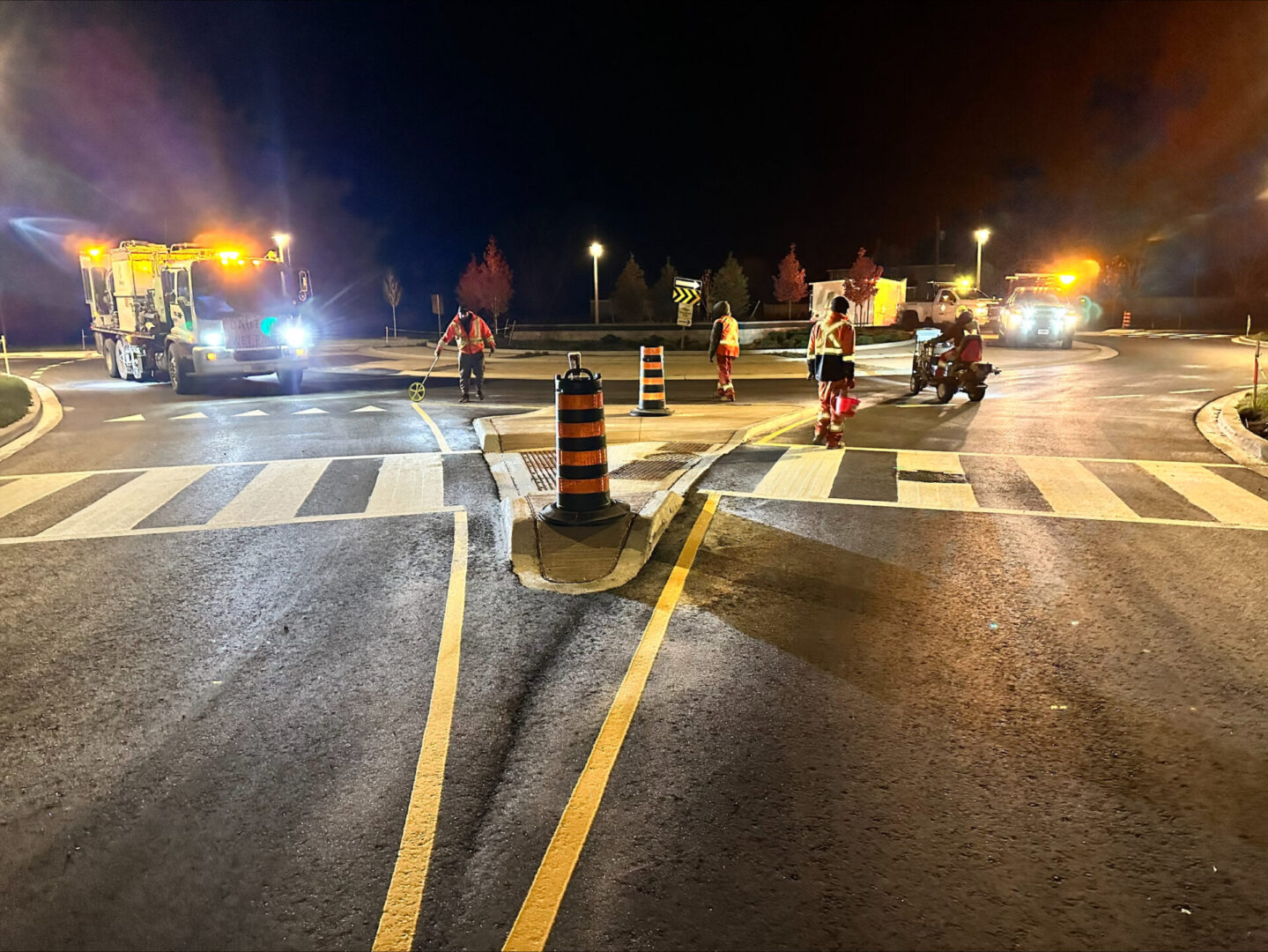 workers at work on the road at night