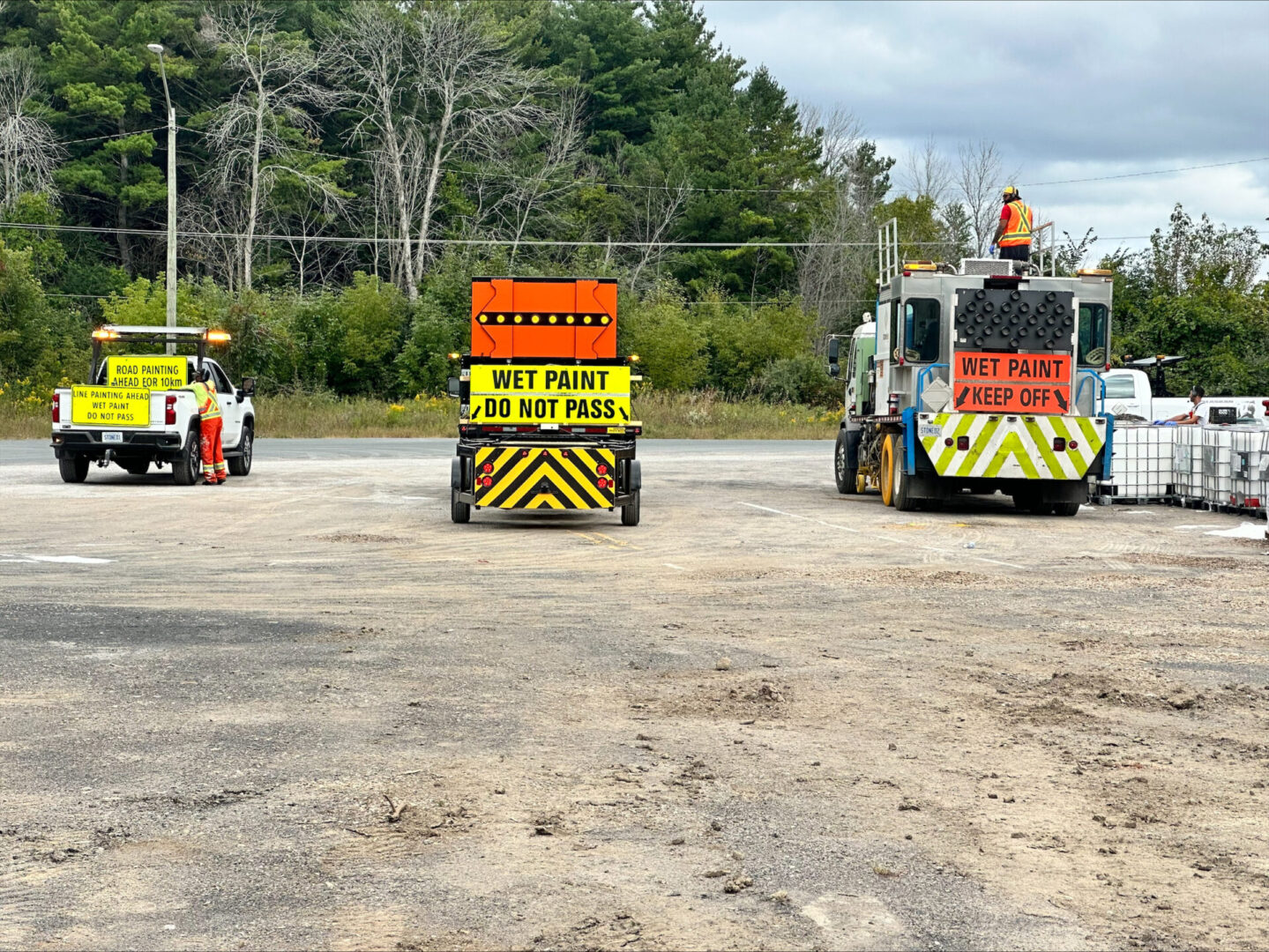 back view of three vehicles on the road